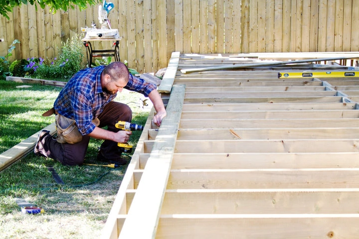 Professional crew installing a custom backyard deck in a Las vegas residential property